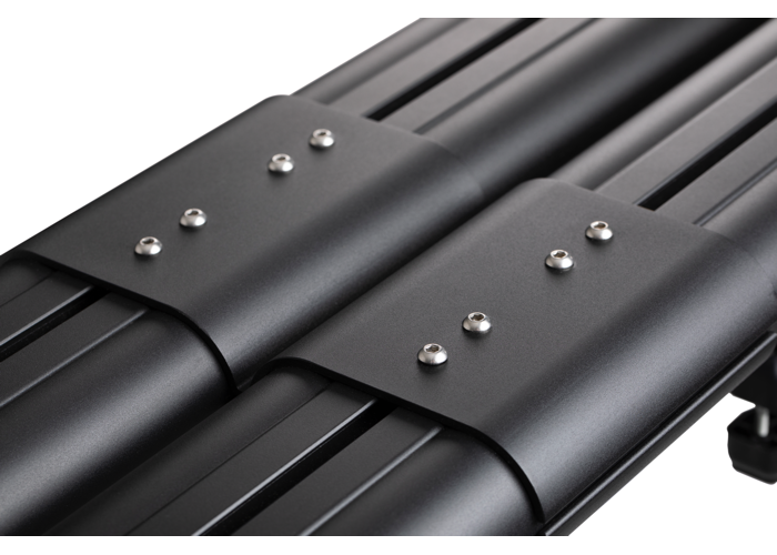 Close up of the black couplers on a black 4-banger river quiver. Metal looks brushed and spotless. The background is white. 